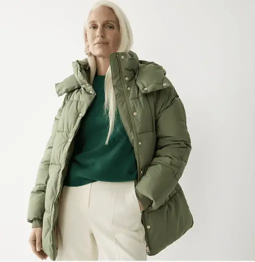 Casual Puffer Jacket with Green Sweater and White Trousers — Winter Outfits for Older Women