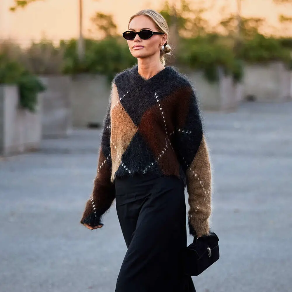 Cropped Fair Isle with Wide-Leg Pants and Boots — A Woman Walks Outdoors Wearing A Fuzzy Cropped Fair Isle with Wide-Leg Pants and Boots — A Woman Walks Outdoors Wearing A Fuzzy — Fair Isle Sweater Outfits