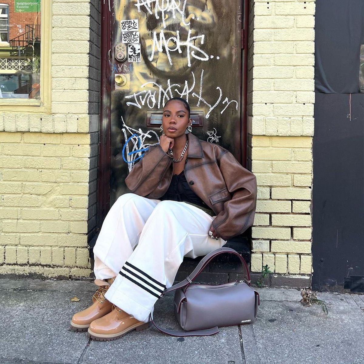 Modern Utility: Tan Timberlands with White Stripes and Leather Jacket — Timberland Boots Outfits
