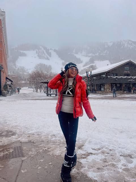Bright Red Puffer Jacket and Patterned Sweater for Classic Apres Ski Bright Red Puffer Jacket and Patterned Sweater for Classic Apres Ski — Apres Ski Outfits