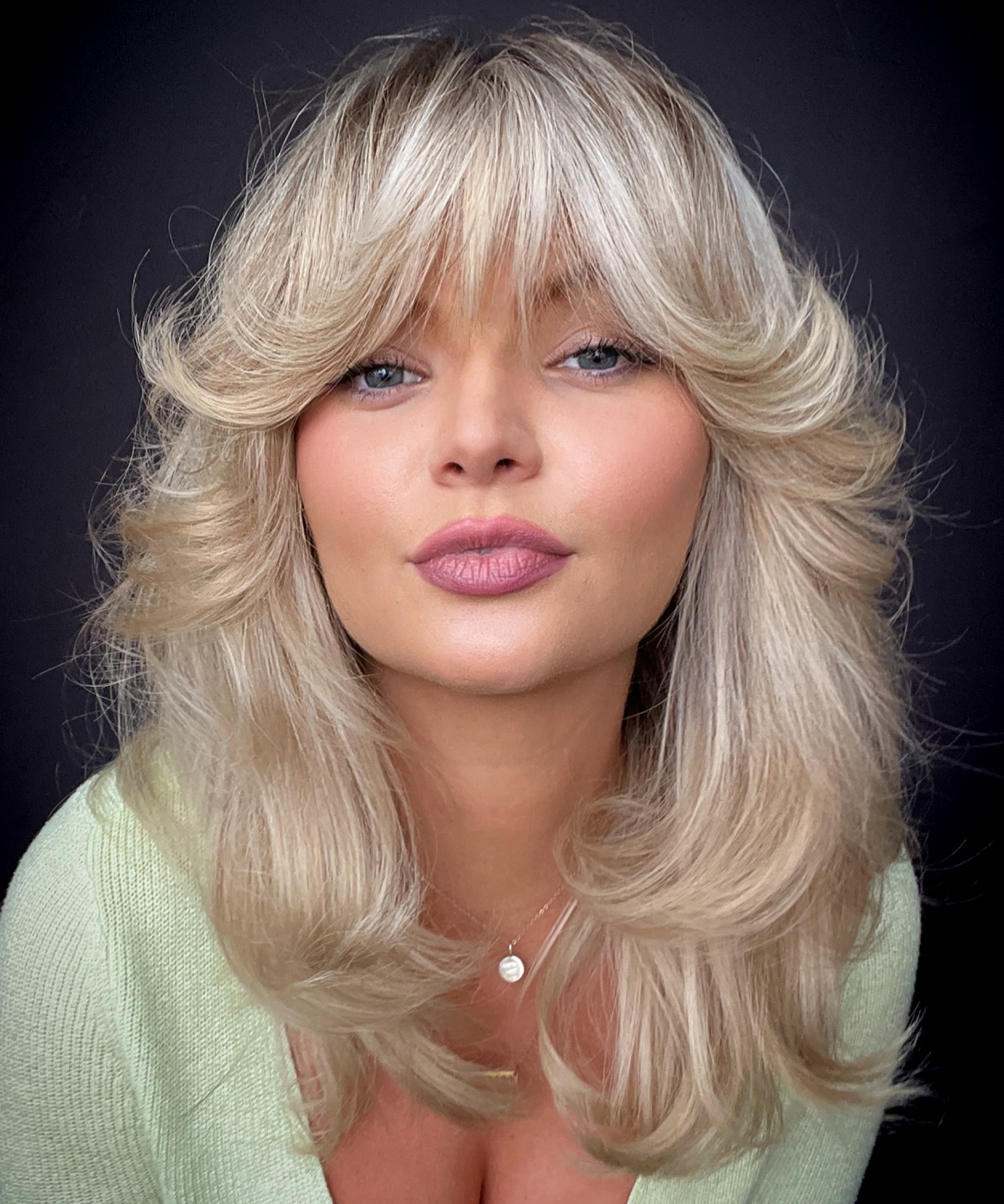 Voluminous Ash Blonde Blowout With Curtain Bangs Voluminous Ash Blonde Blowout With Curtain Bangs — Winter Hair Colors for Plus Size Women