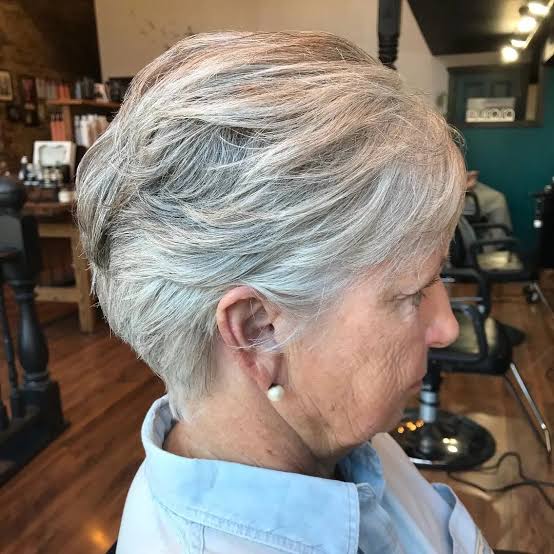 Silver Layered Cut With Wispy Bangs — Winter Hairstyles for Women Over 70