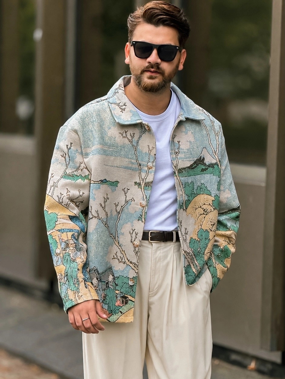 Printed pale green overshirt white tee cream trousers and dark belt