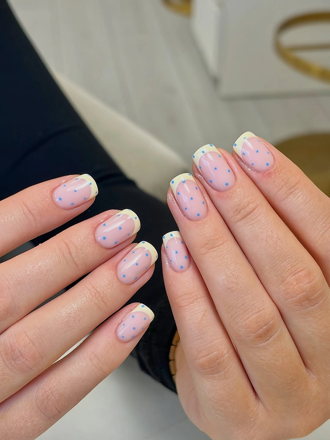 Short almond pastel nails with blue yellow tips and fine dots