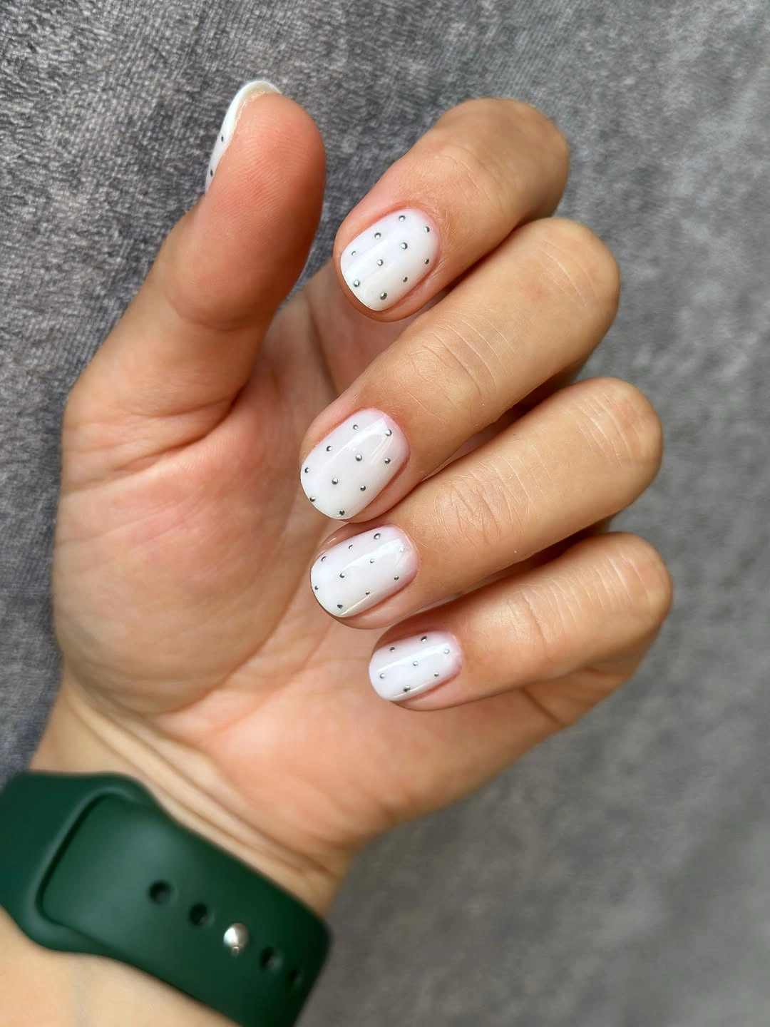 White short nails with tiny dark dot grid details