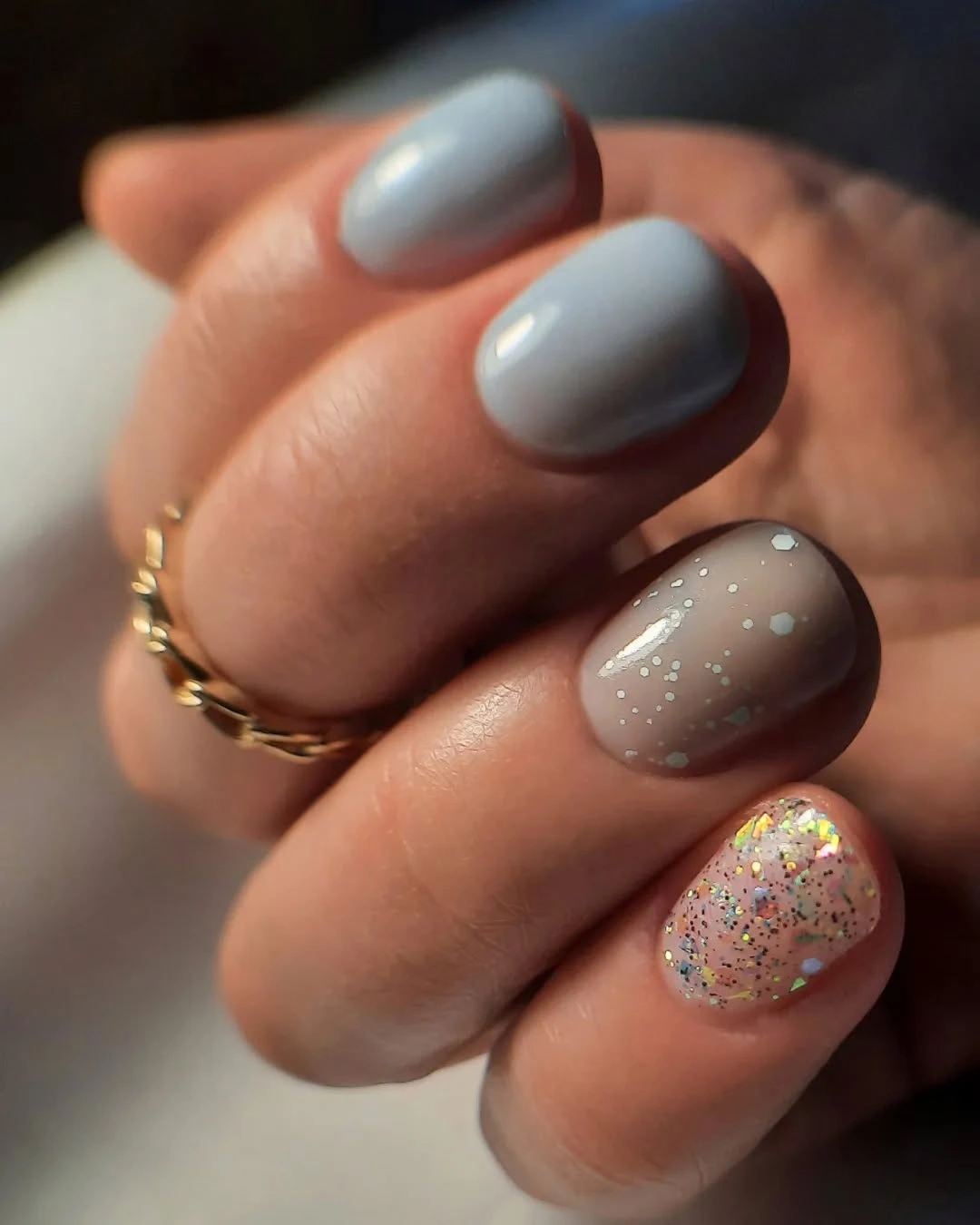 Gray neutral short nails with taupe speckles and glitter accent