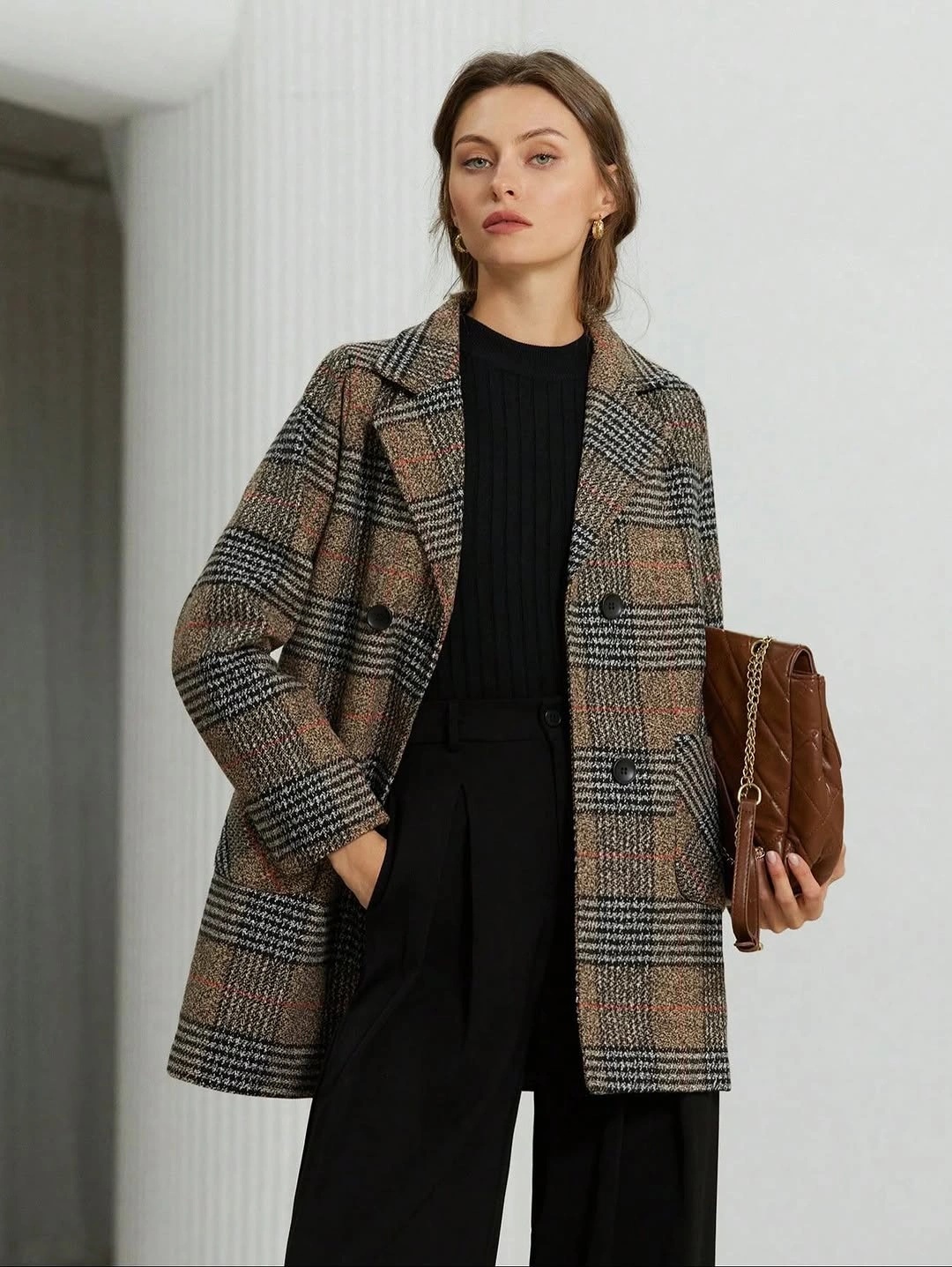 Plaid tailored coat with black outfit and brown shoulder bag
