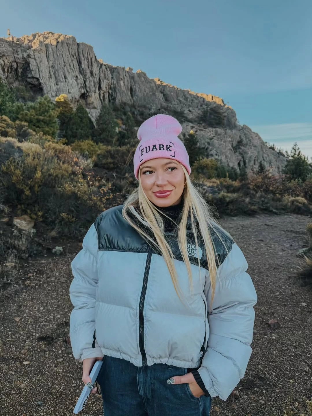 Light blue color-block puffer jacket with pink beanie and blue jeans
