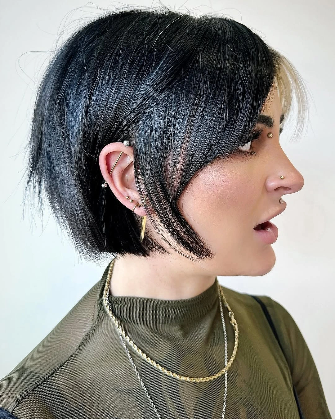 Warm brown hair with full fringe and long tapered ends