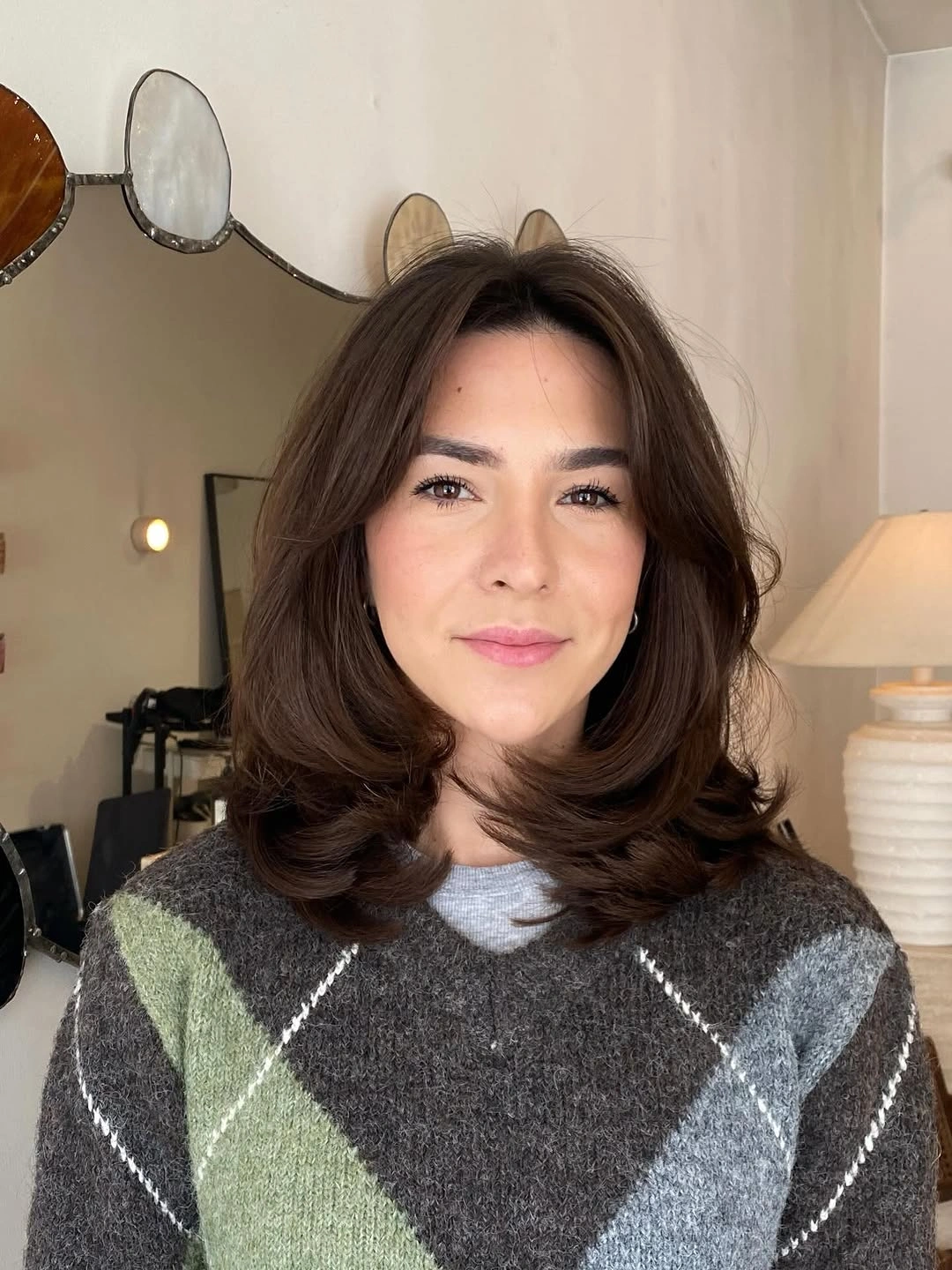 Short tapered sides with longer choppy hair across the top
