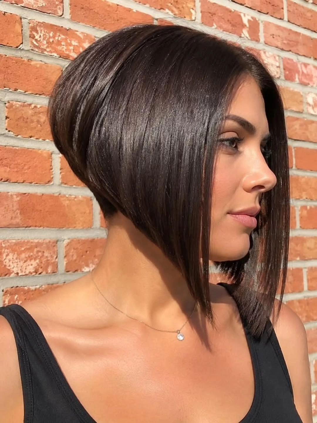 Short warm brown cut with sweeping front and flipped nape ends