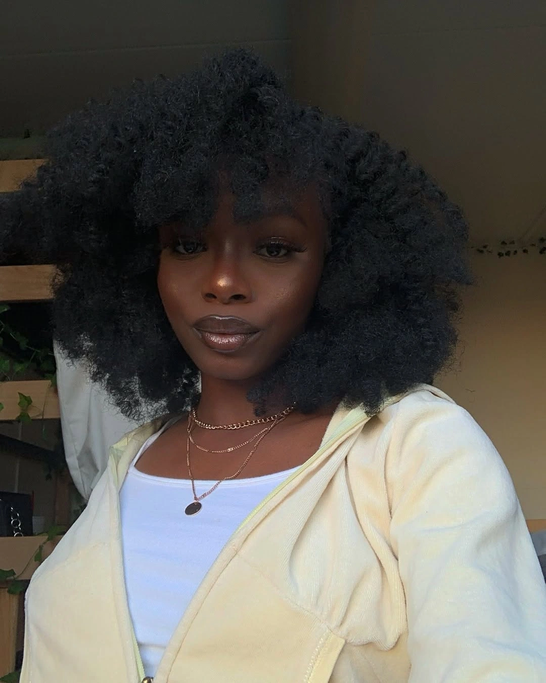 Large rounded dark curls with soft front fringe
