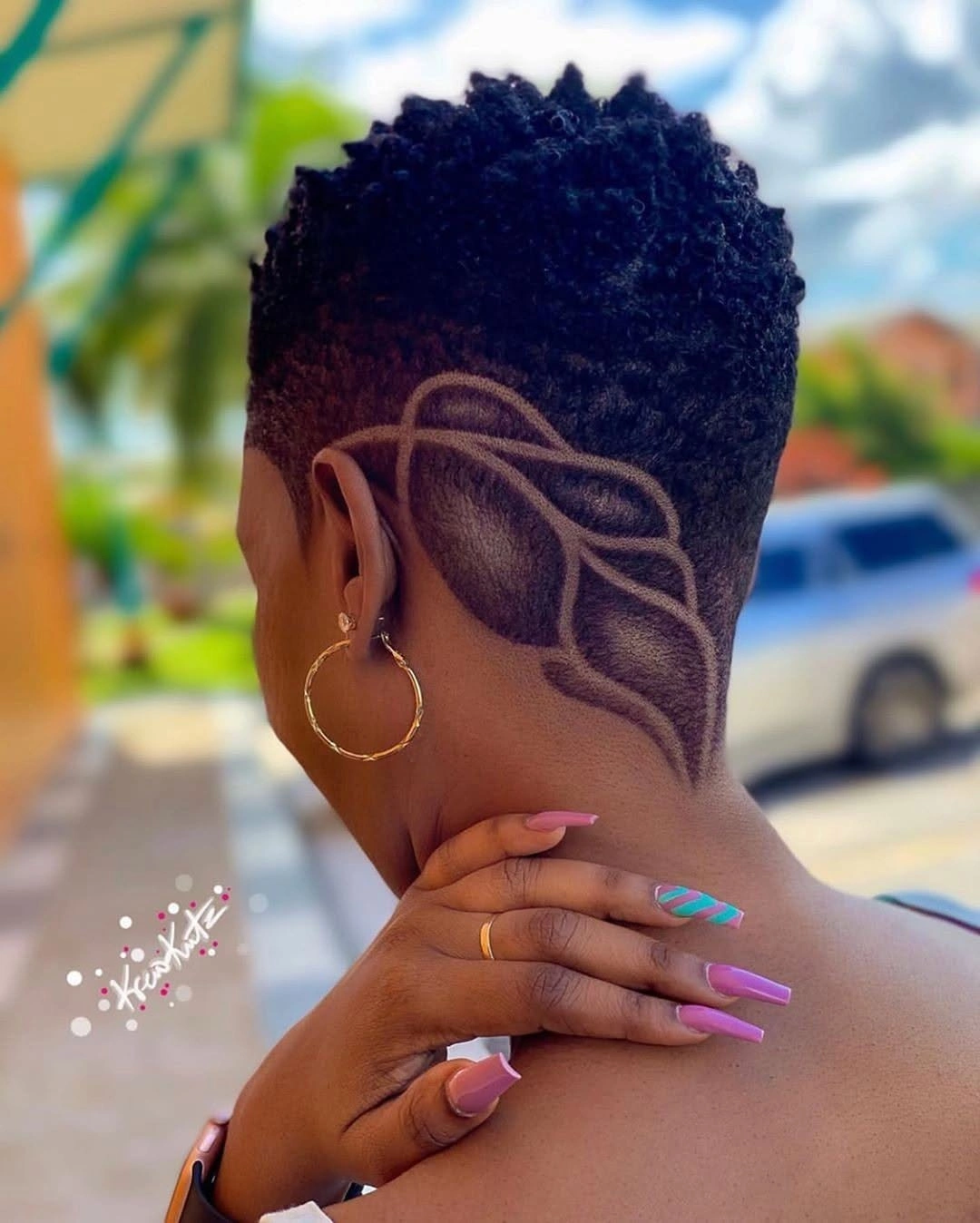 Very short top with curved shaved side design