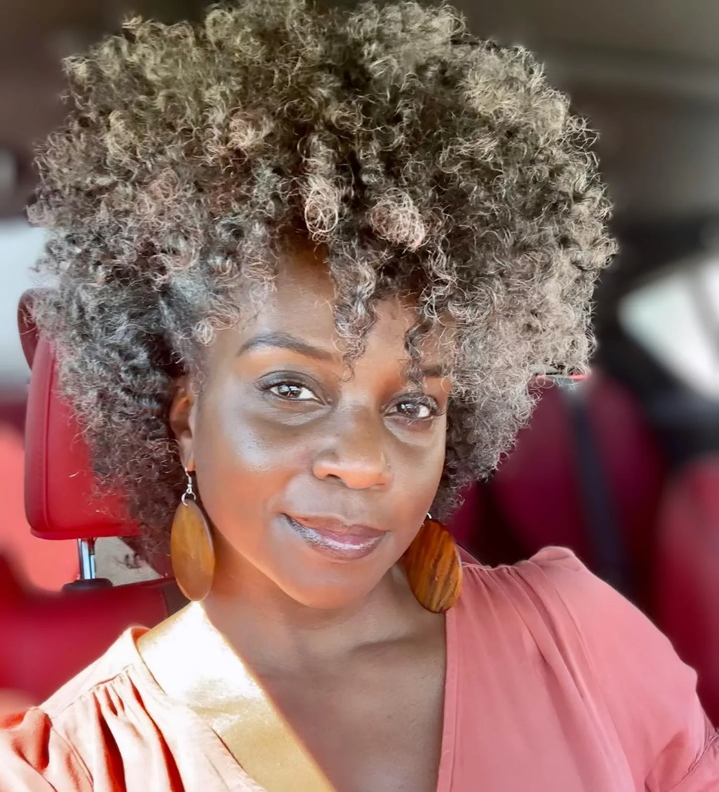 Rounded gray curls with visible soft front fringe