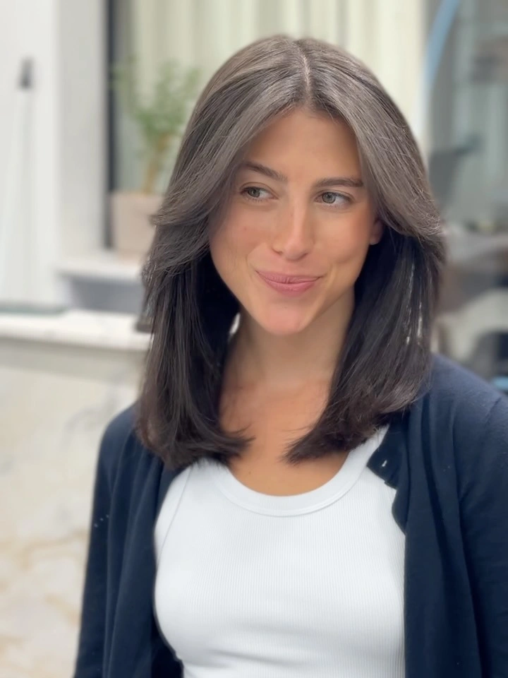 Dark gray shoulder-length layers with center part