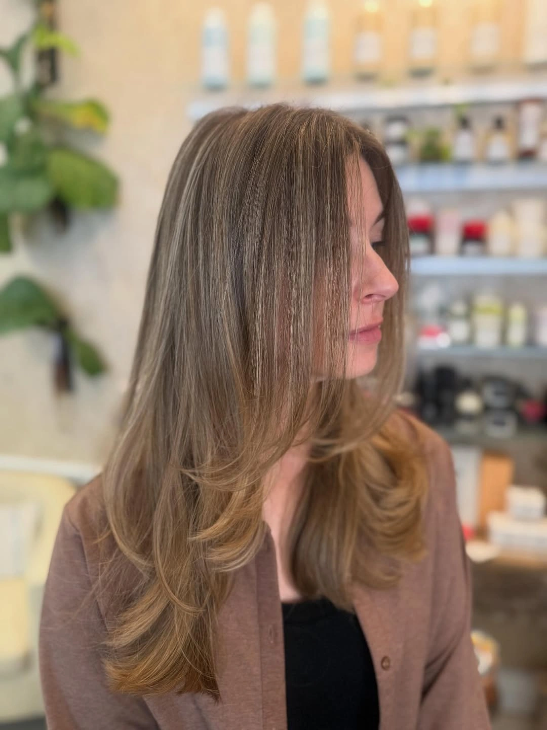 Long brown hair with middle part and soft bends