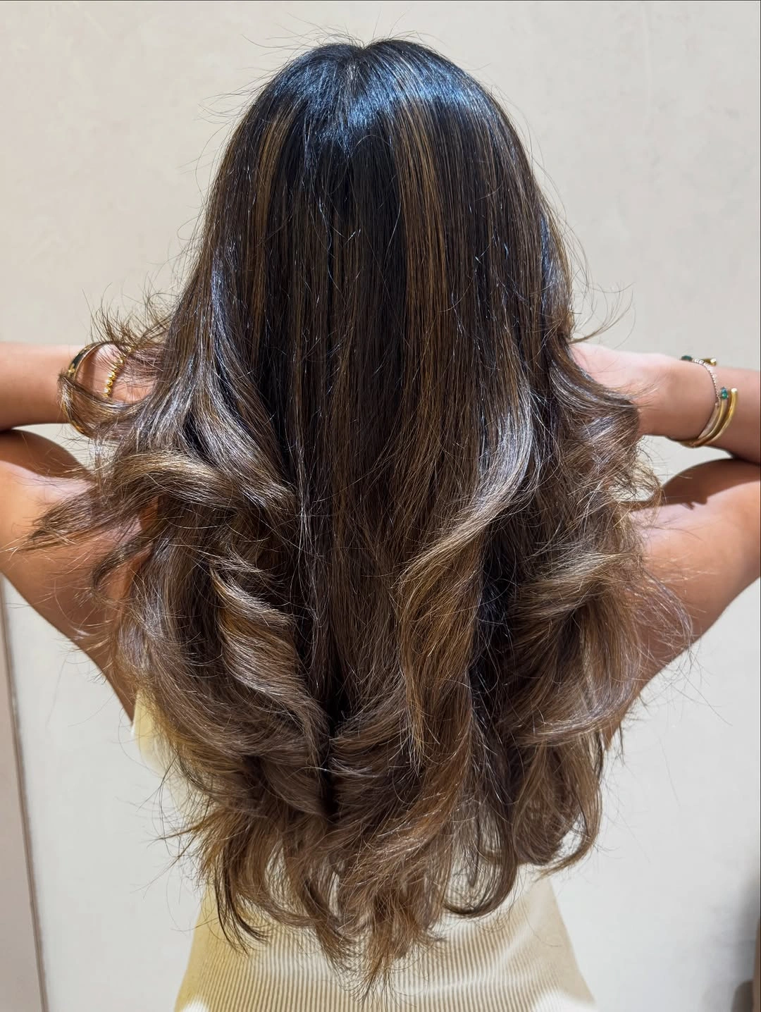 Long dark brown waves with lighter layered ends