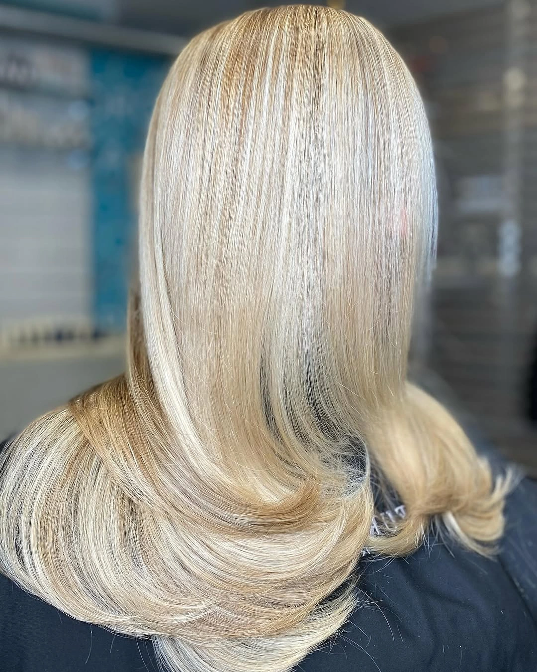 Long pale blonde hair with smooth back view and turned ends