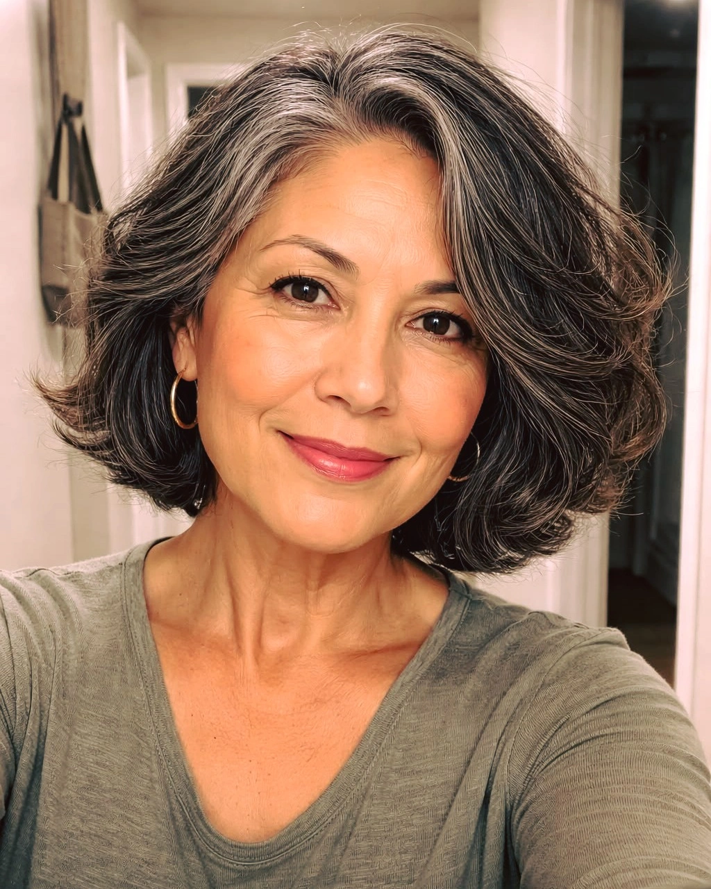 Short-to-medium salt-and-pepper waves with side part