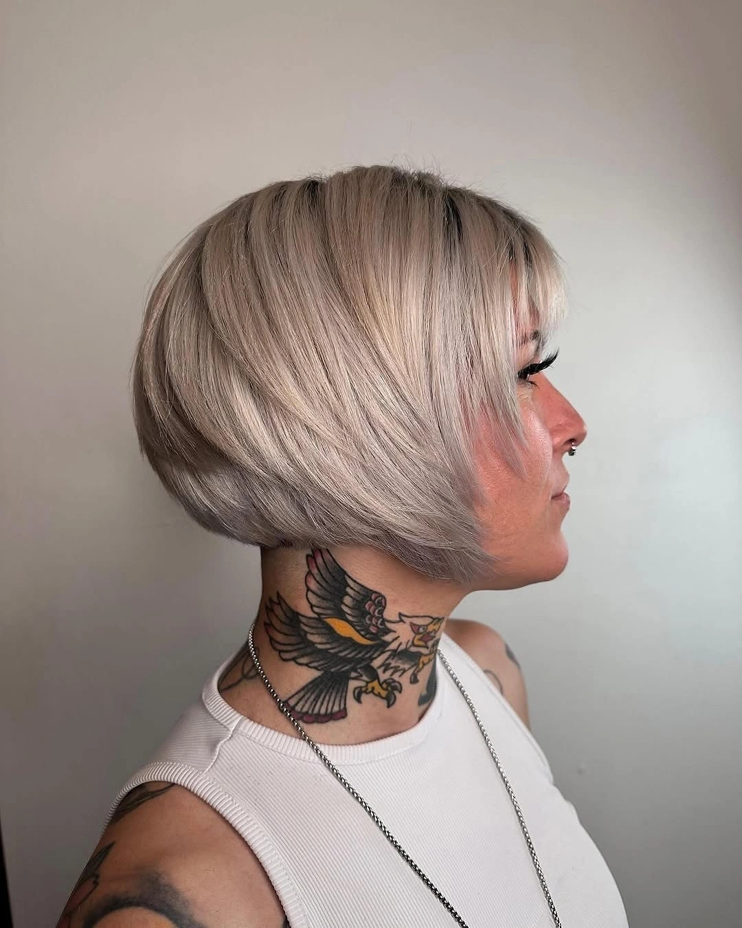 Pale ash-blonde rounded short bob in side view