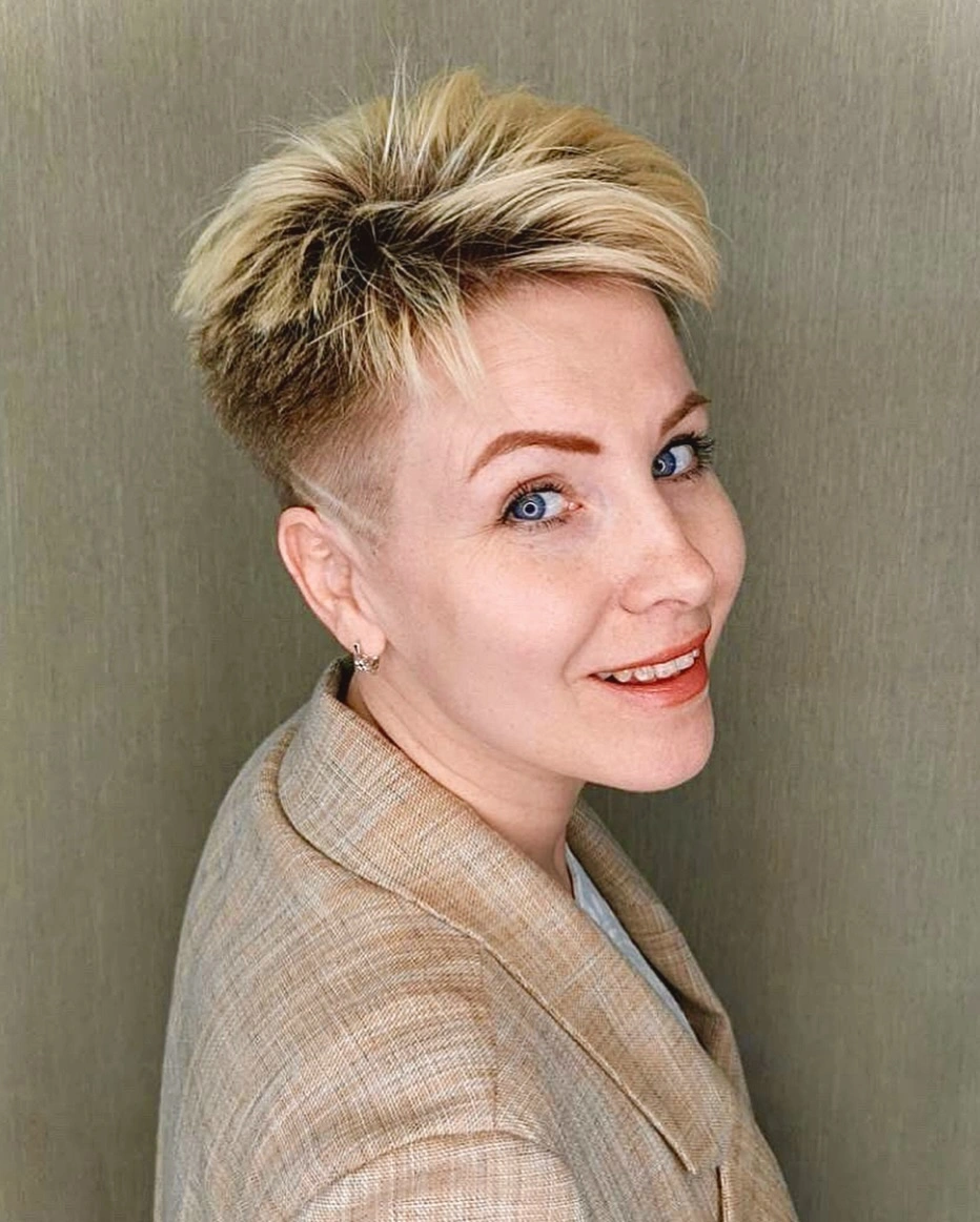 Very short blonde top with close undercut-style sides