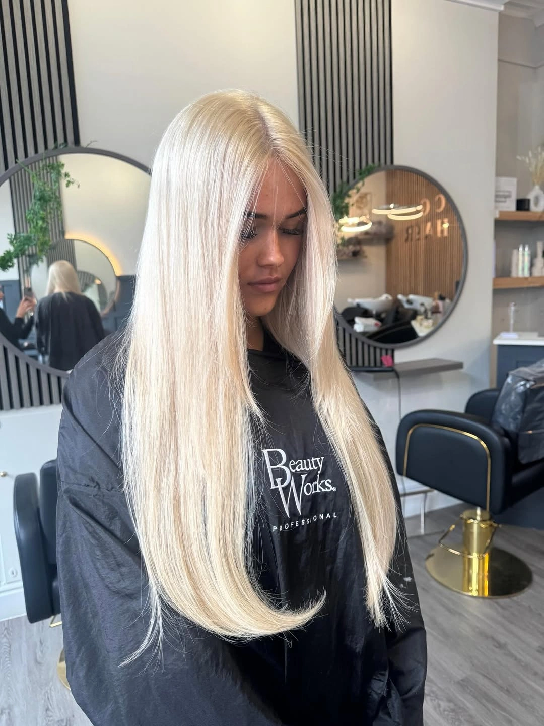 Very long pale blonde hair with mostly straight lengths
