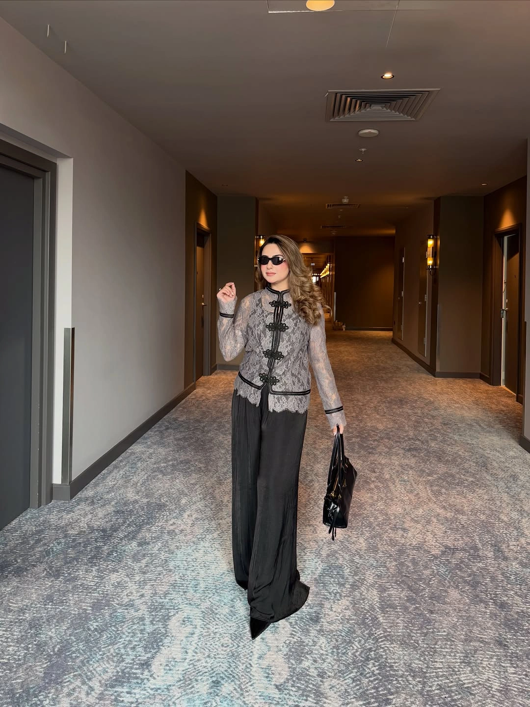 Sheer gray patterned top with long black flowing bottom