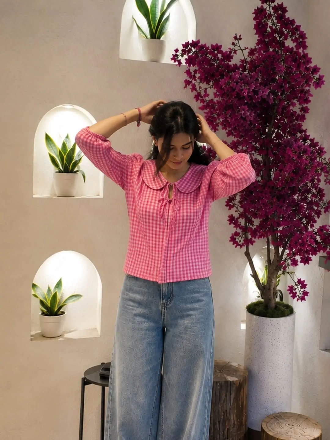 Pink gingham top with rounded collar and wide jeans