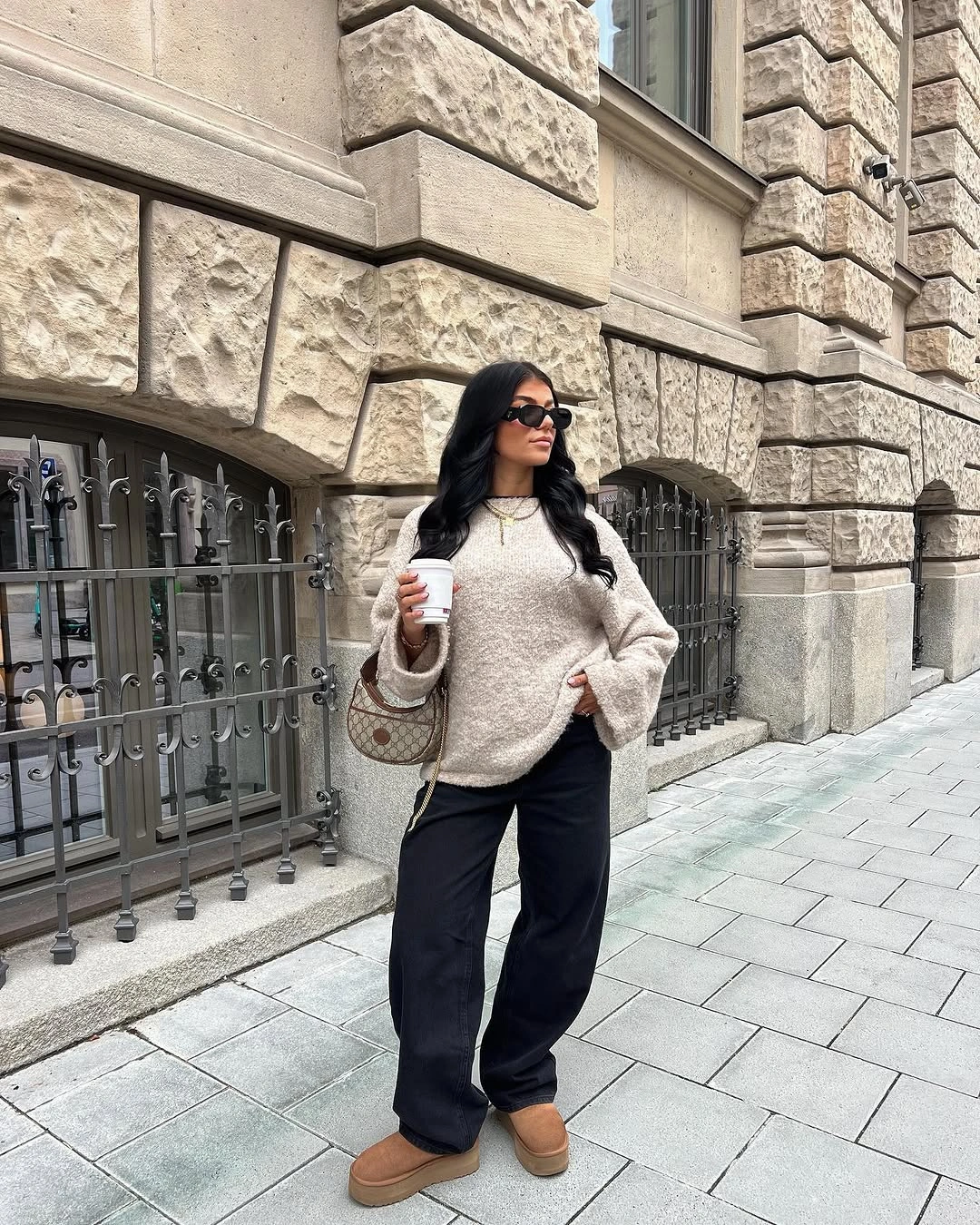 Cream textured knit with black pants and tan platform shoes