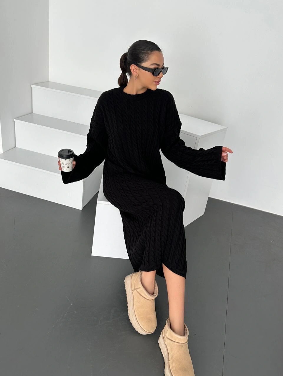 Black cable-knit midi dress with pale soft footwear