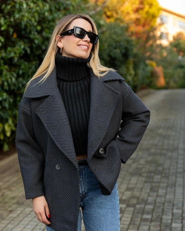Gray herringbone outer layer with black turtleneck and jeans
