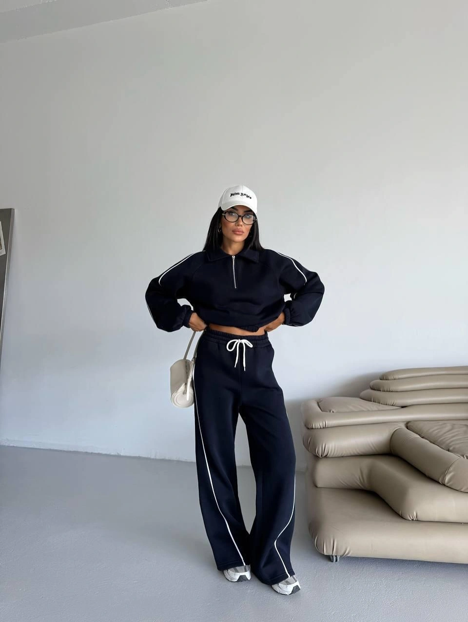 Dark sporty set with white cap and striped pants