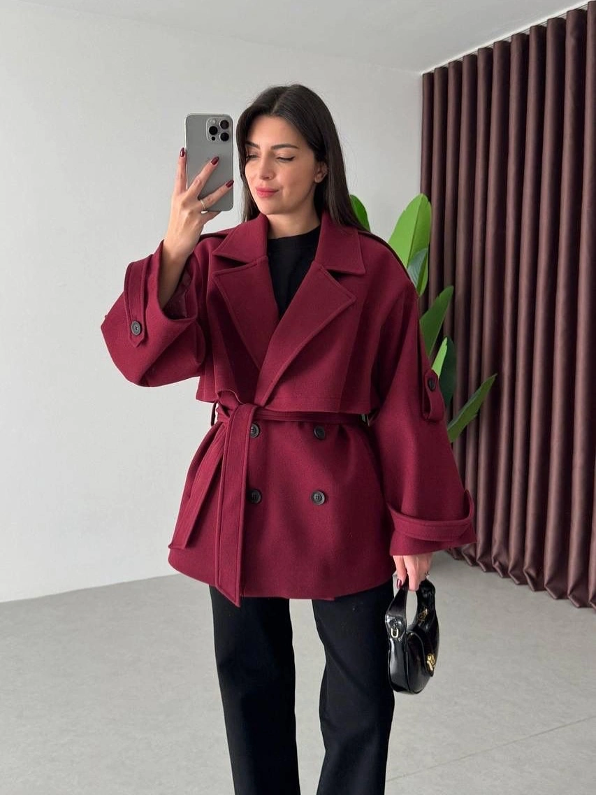Burgundy belted short coat over black separates
