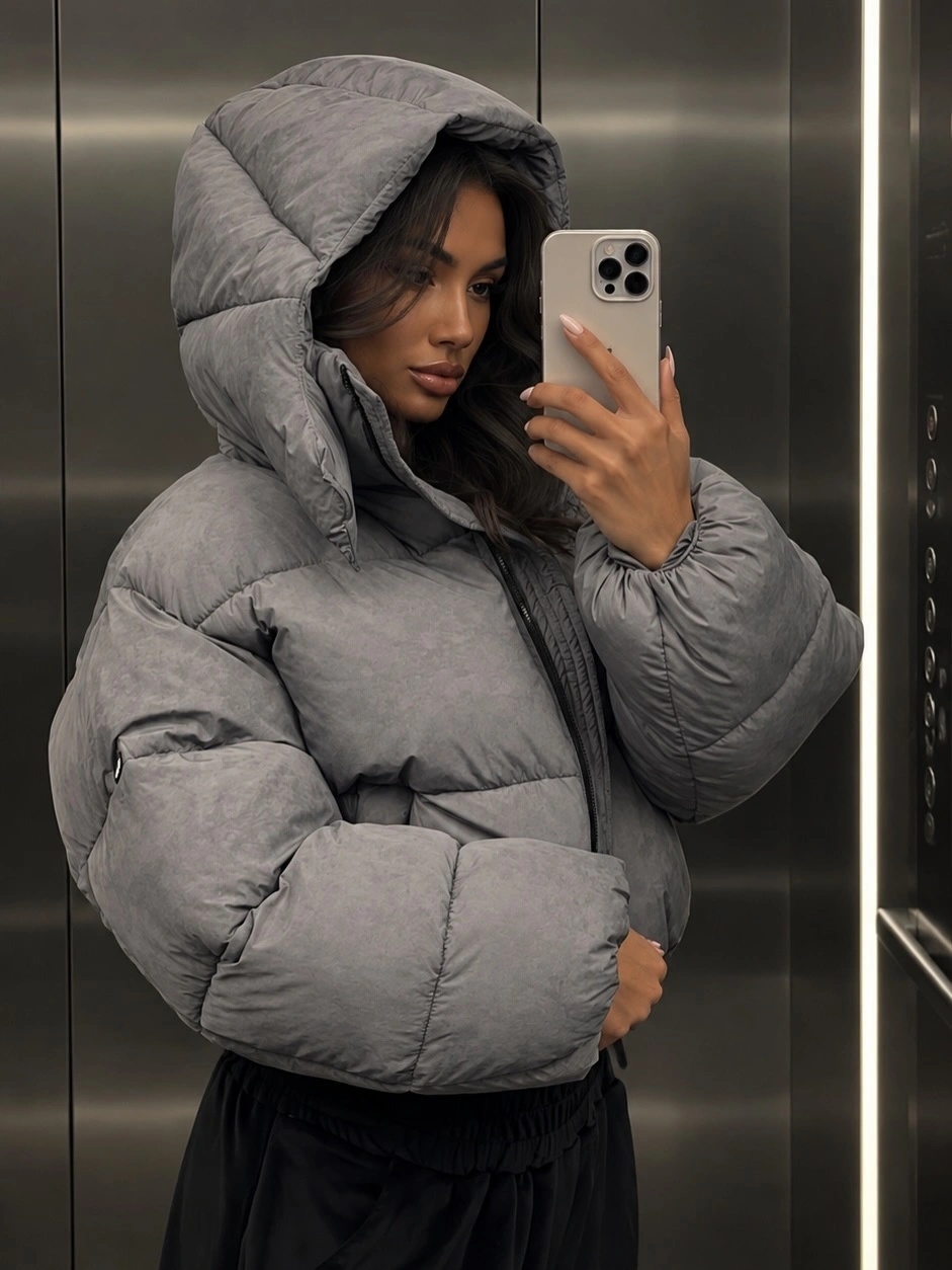 Gray hooded cropped puffer with black relaxed pants