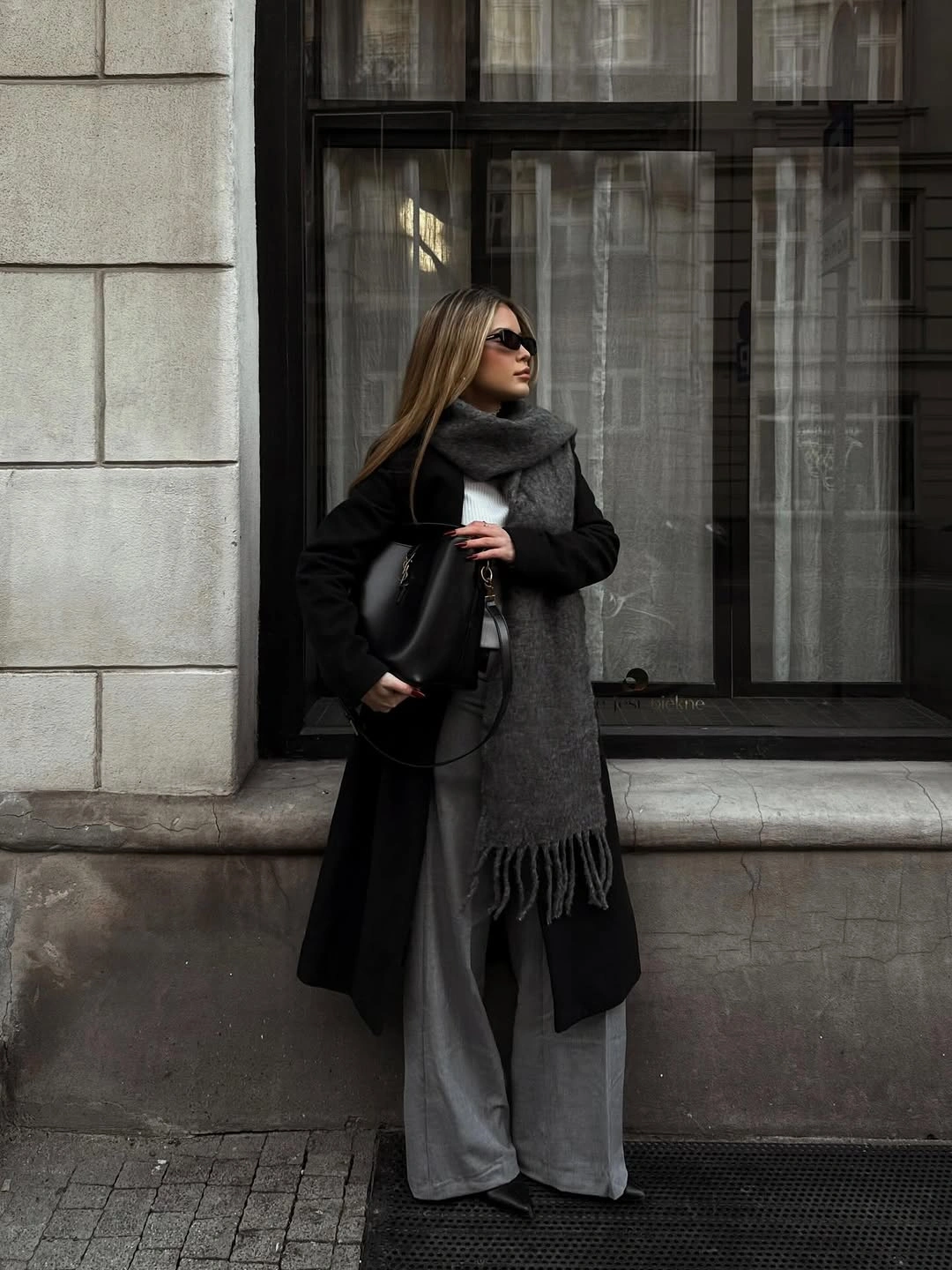 Black coat with gray wide trousers and charcoal scarf