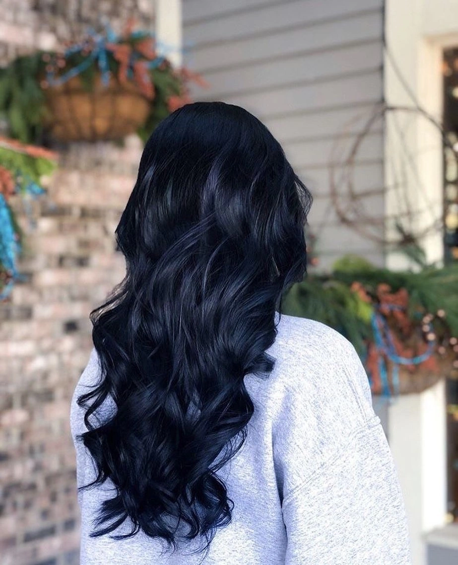 Very long blue black wavy hair with layered movement from the back