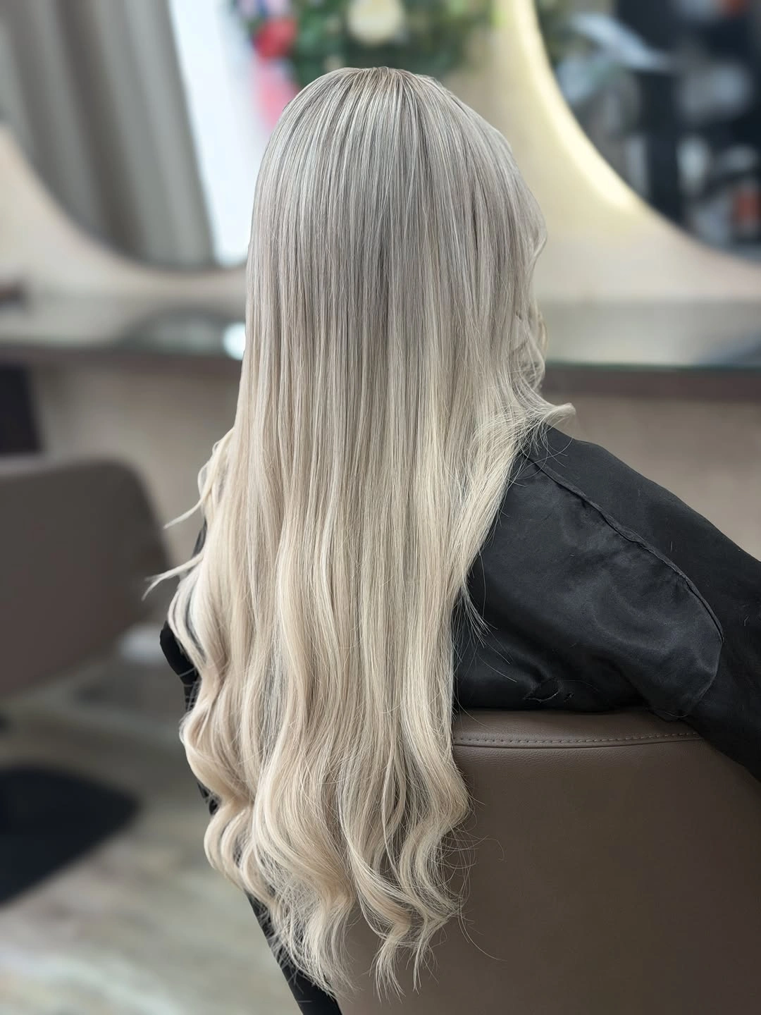 Long silver-white blonde hair with cool gray roots