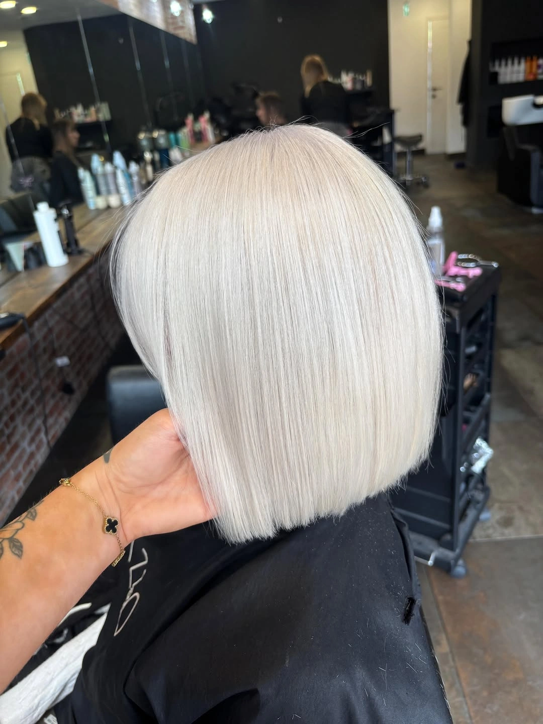 Chin-length blunt bob with nearly white icy blonde color
