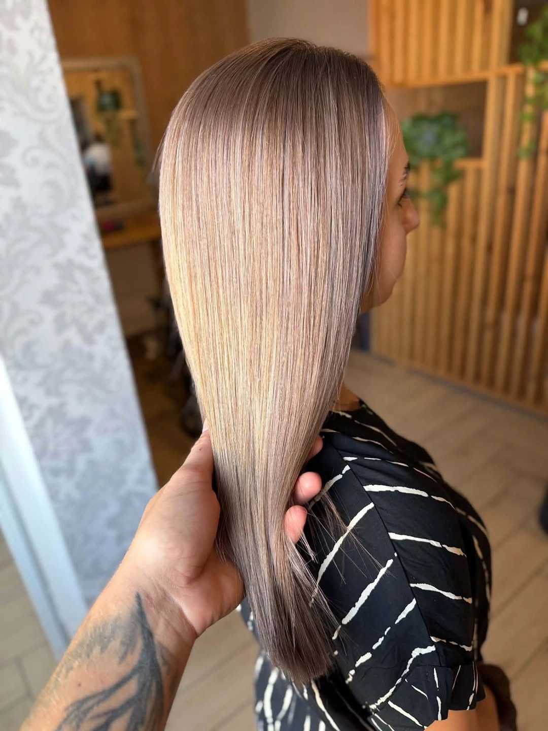 Long straight rosy-taupe blonde hair with deeper cool roots