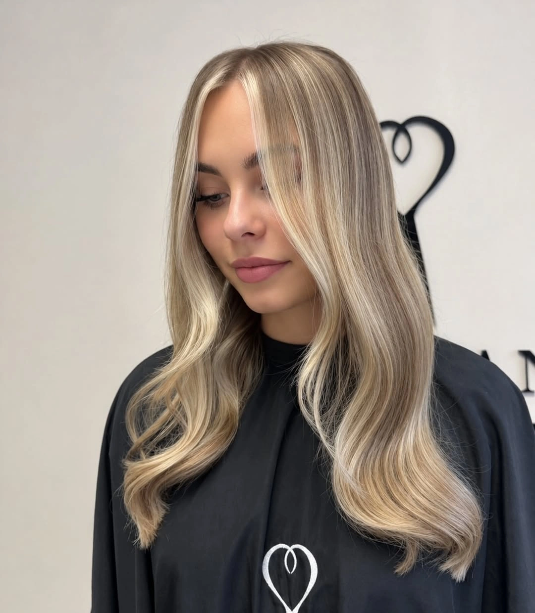 Medium-long blonde with creamy front pieces and sandy roots