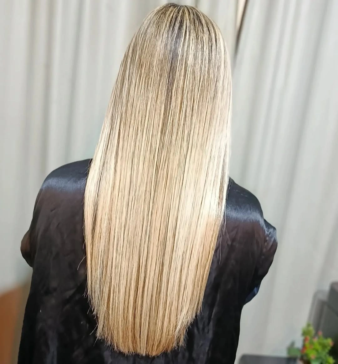 Very long straight blonde hair with fine cream and beige ribbons