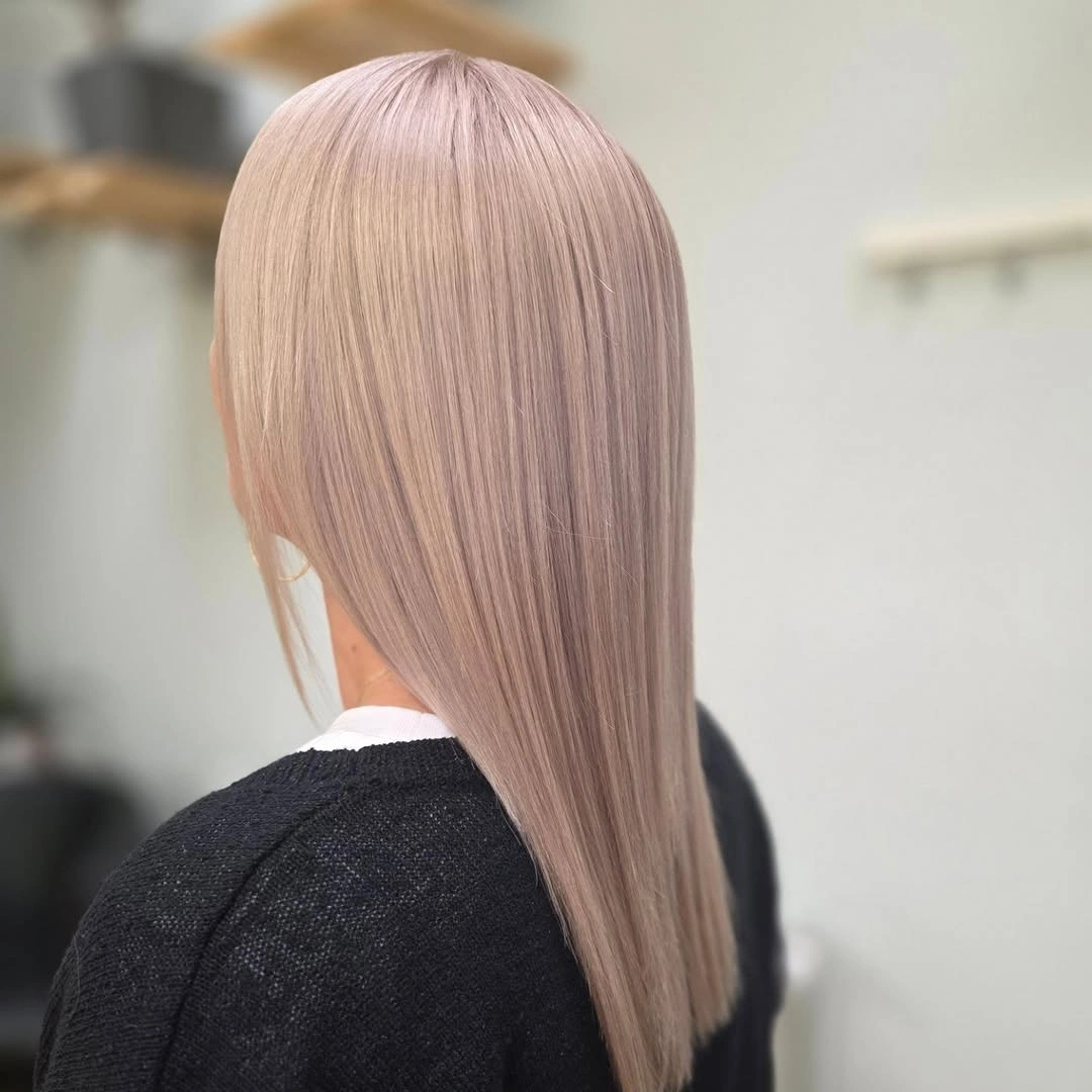 Straight pale blonde hair with dusty pink-lavender cast