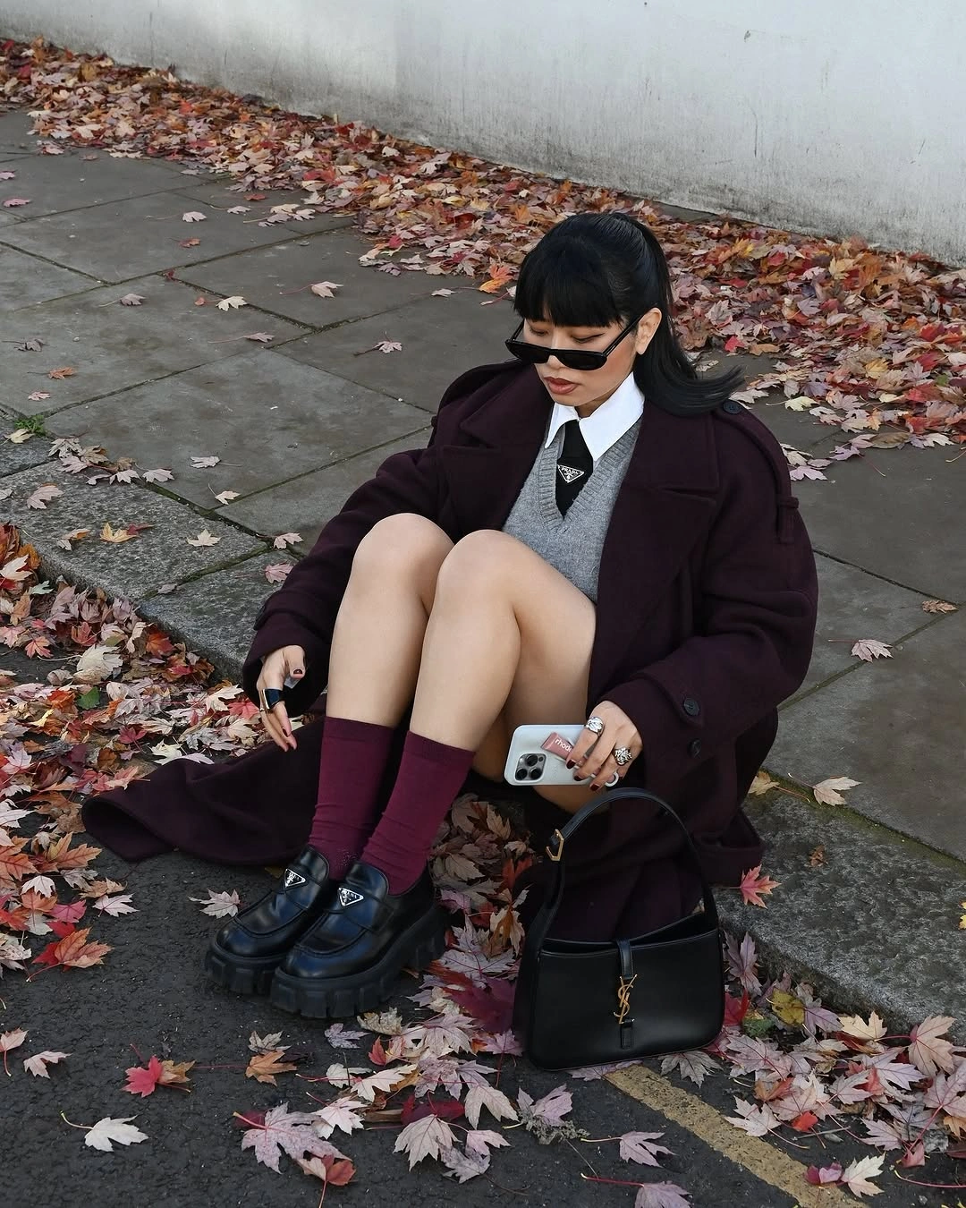 Burgundy coat with gray vest, tie, socks and chunky loafers