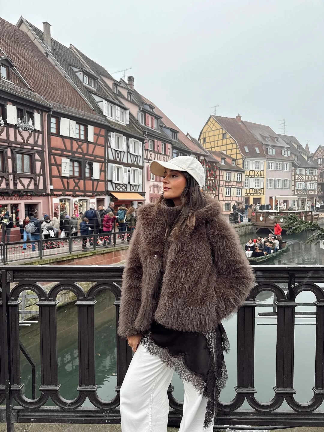 Shaggy taupe-brown coat with cream cap and white wide trousers