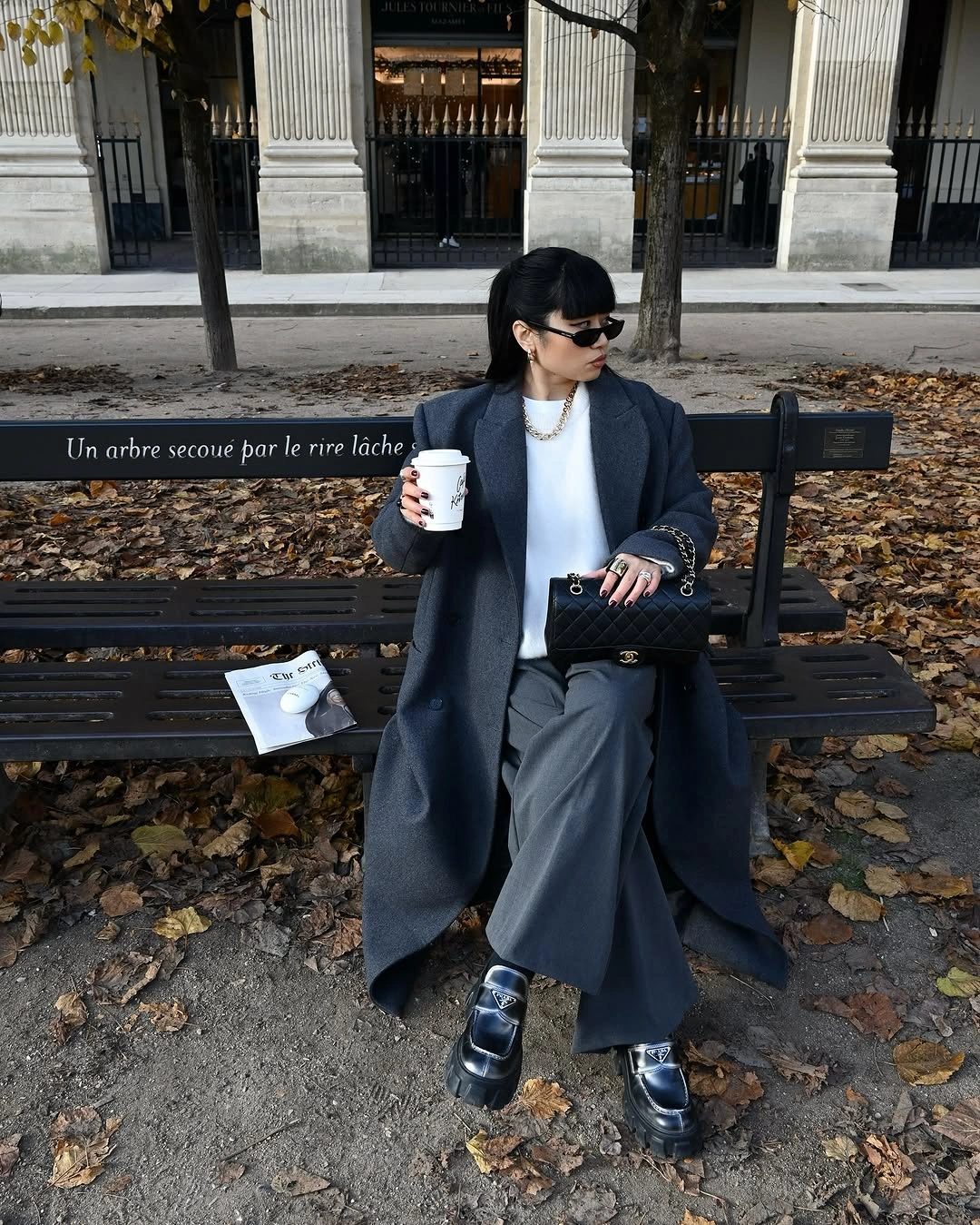 Charcoal coat with white top wide gray trousers and chunky loafers