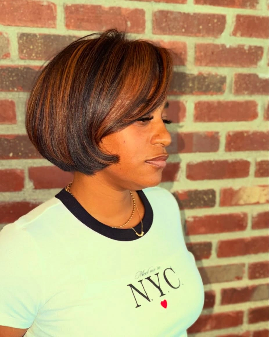 Long layered copper-orange hair with dark lower ends from back