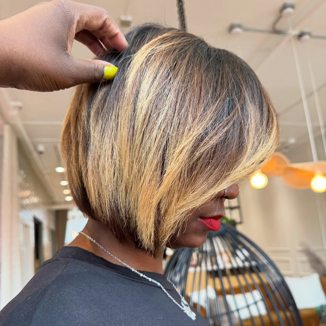 Long near-black curls with a side-parted front swoop