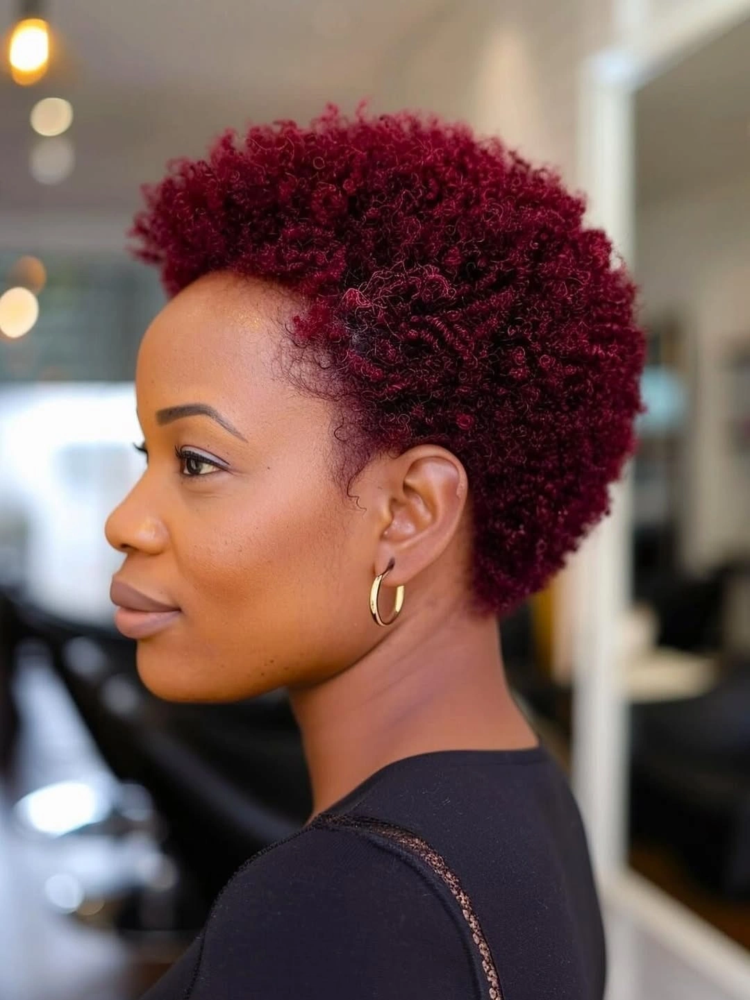 Auburn-brown shoulder-length braids with square parting and curled ends