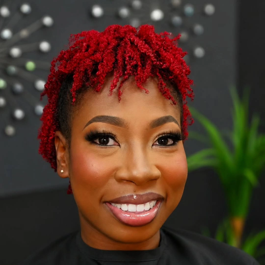 Short tapered cut with purple curls and dark cropped sides