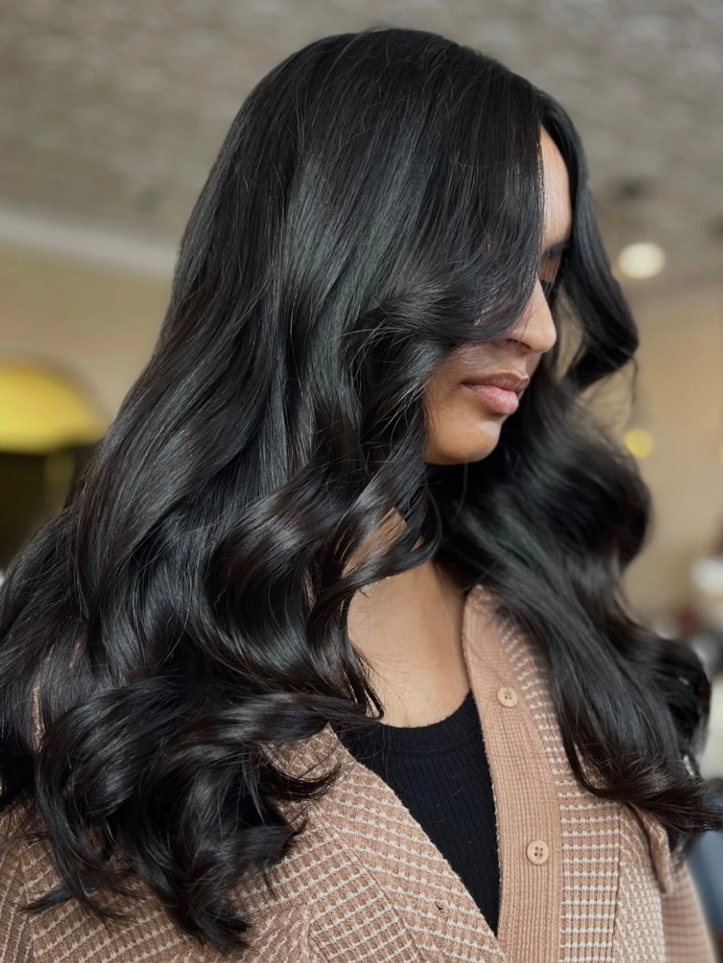 Long black waves with cool slate surface shine